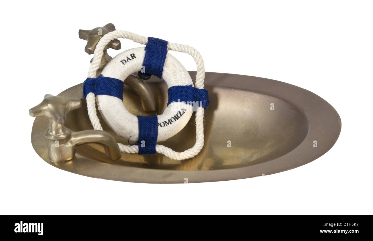 Brass sink with knobs for hot and cold with a floatation device path