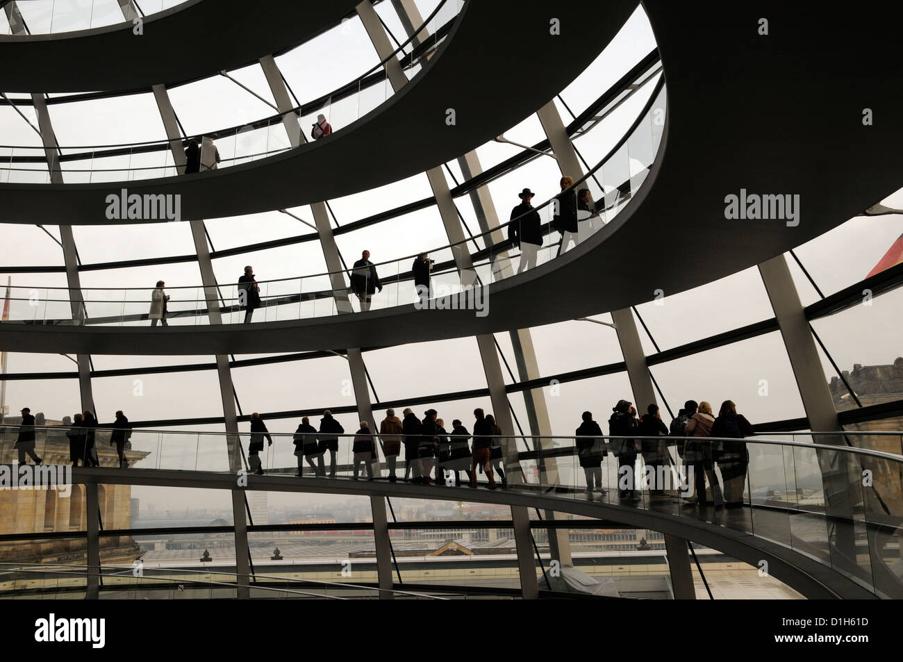Visitors inside the Reichstag Dome in Berlin, designed by Norman Foster Stock Photo