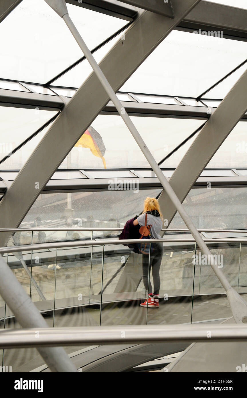 Visitor looking out from the Reichstag Dome in Berlin, designed by Norman Foster Stock Photo