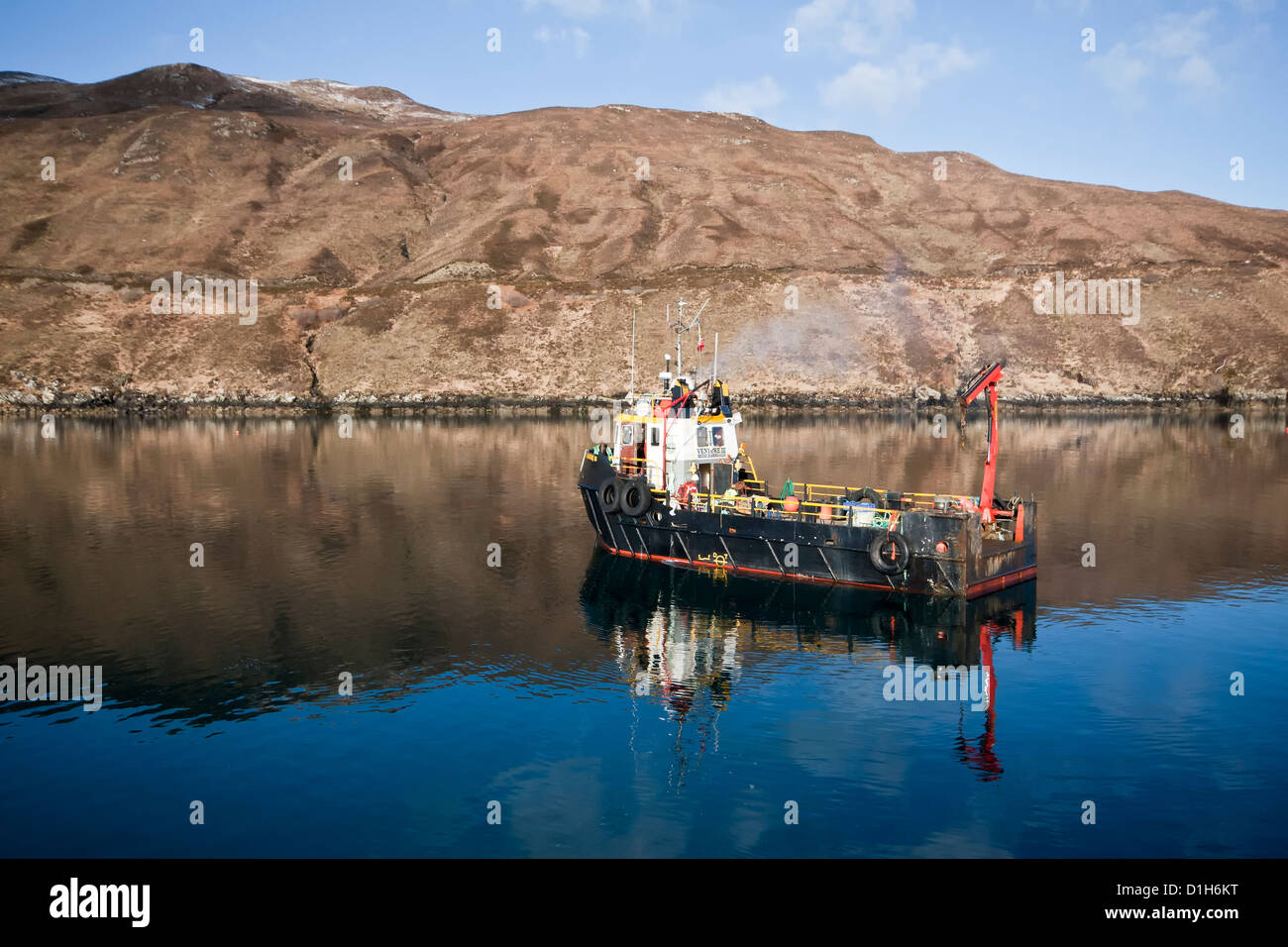 Fish farm boat at salmon farm, Loch Ainort, Isle of Skye, Scotland, UK Stock Photo