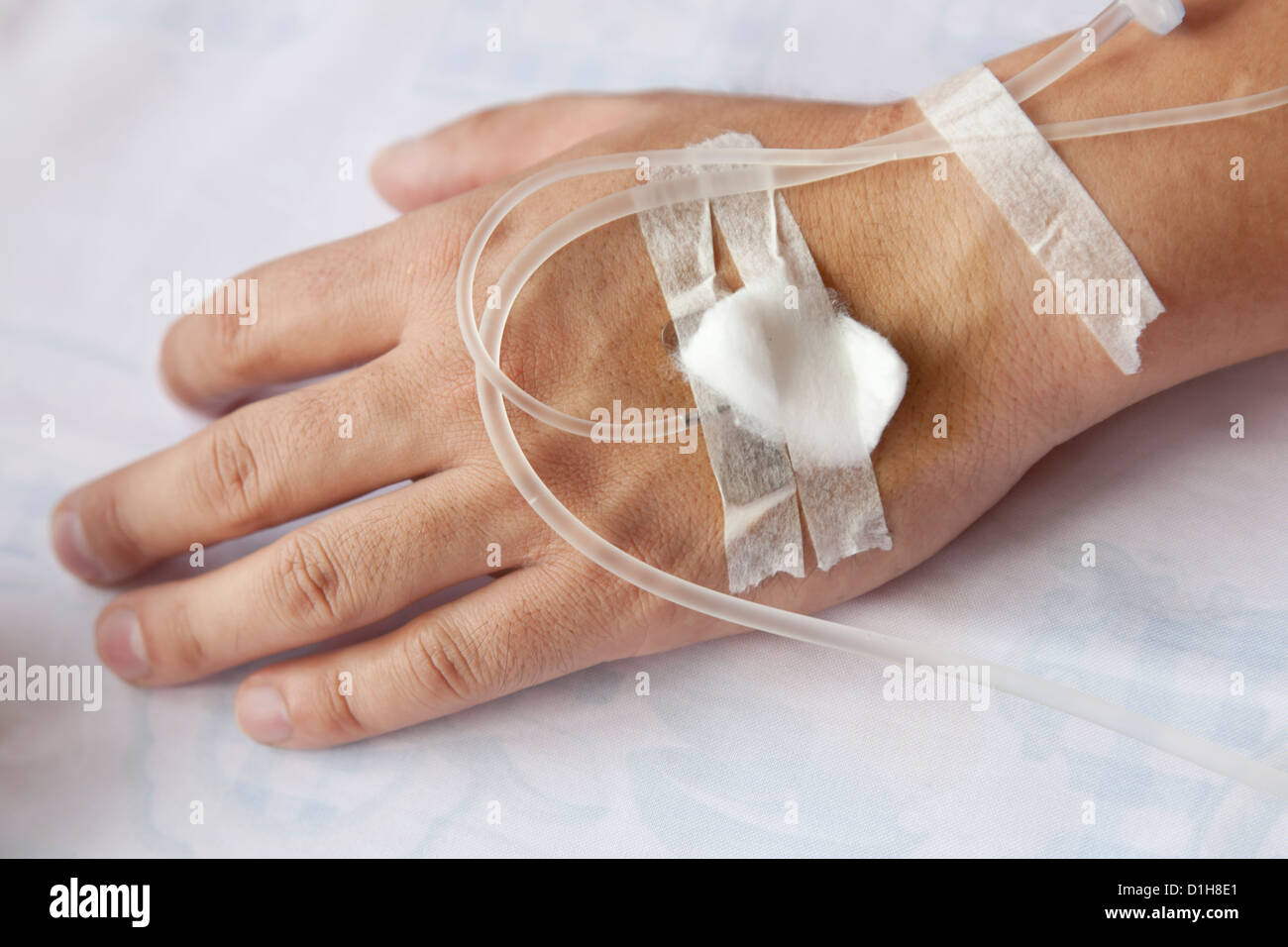 A patient hand with IV drip Stock Photo Alamy