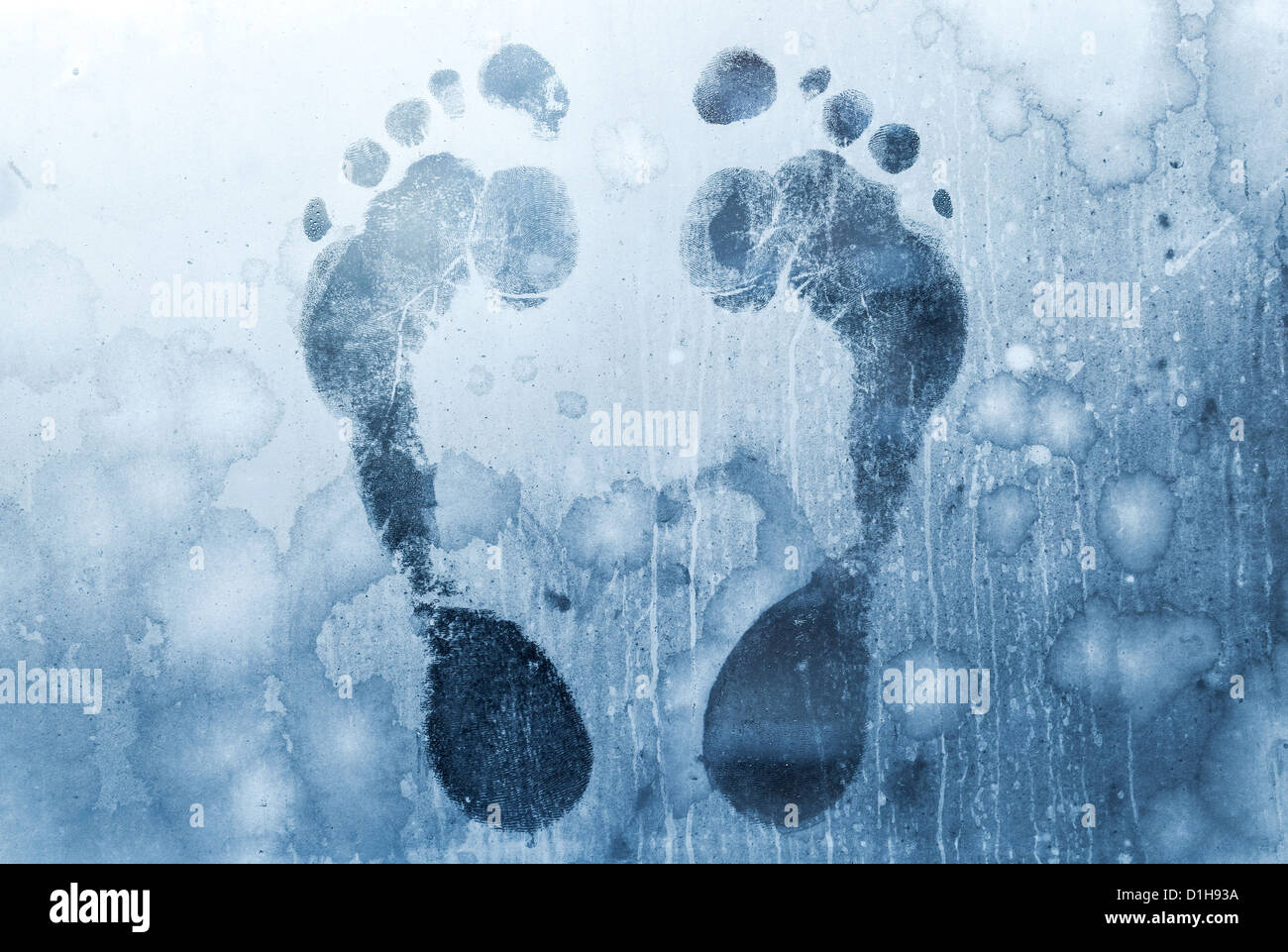 Male foot prints on frozen windows glass Stock Photo