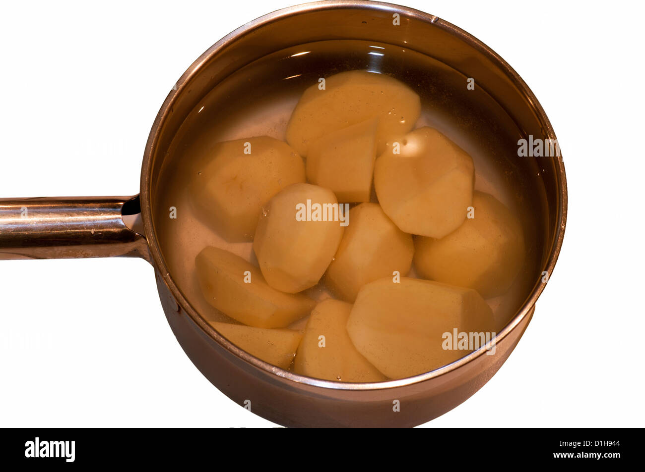 Saucepan Of Peeled Potatoes In Water Stock Photo