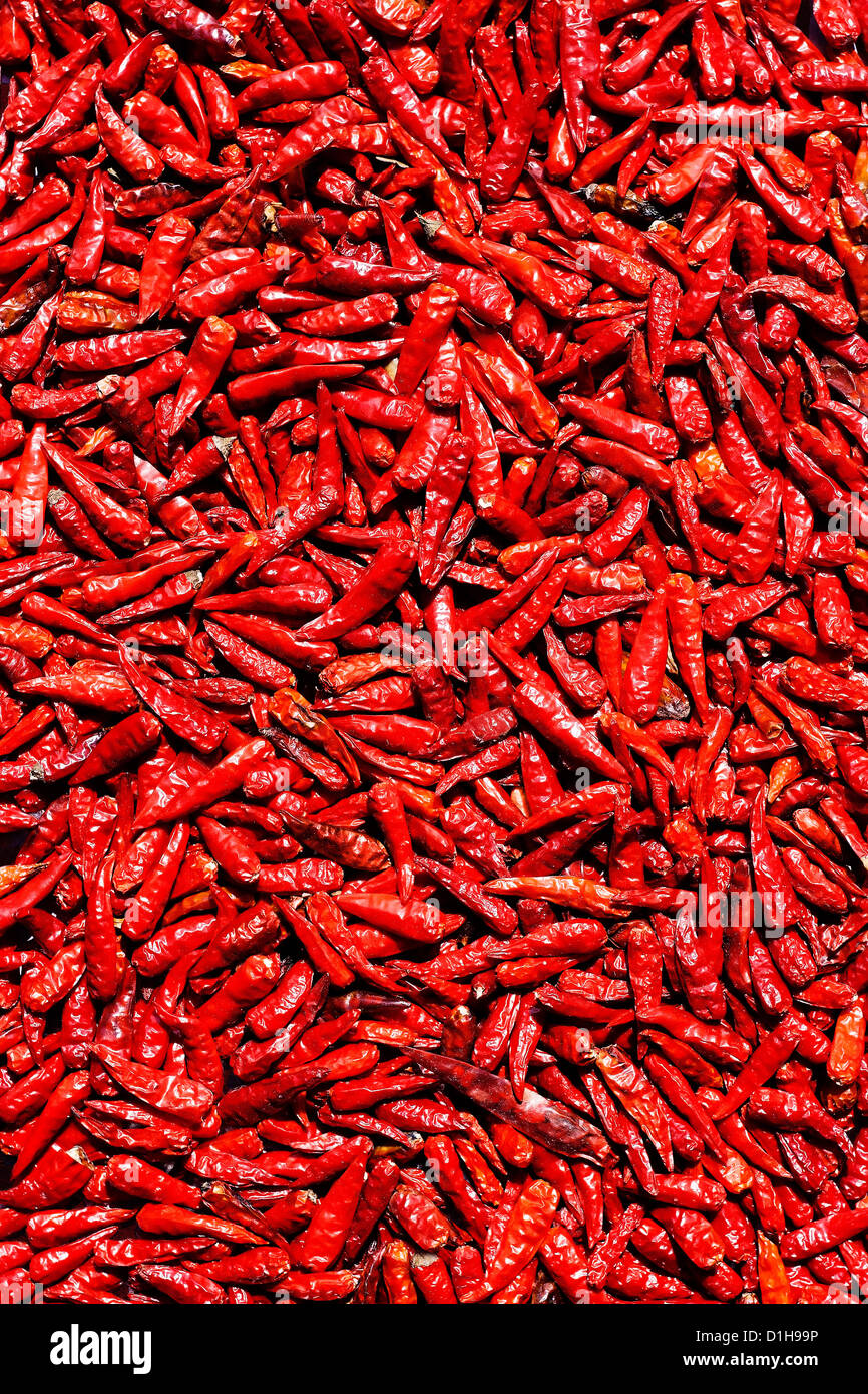 Red hot chili peppers drying background Stock Photo - Alamy