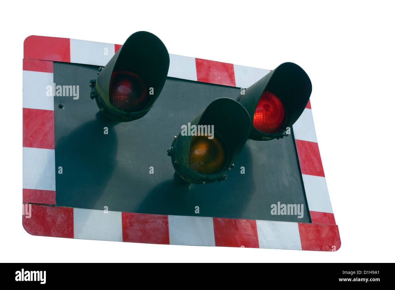 Red Warning Lights Flashing at a Railway Level Crossing Stock Photo