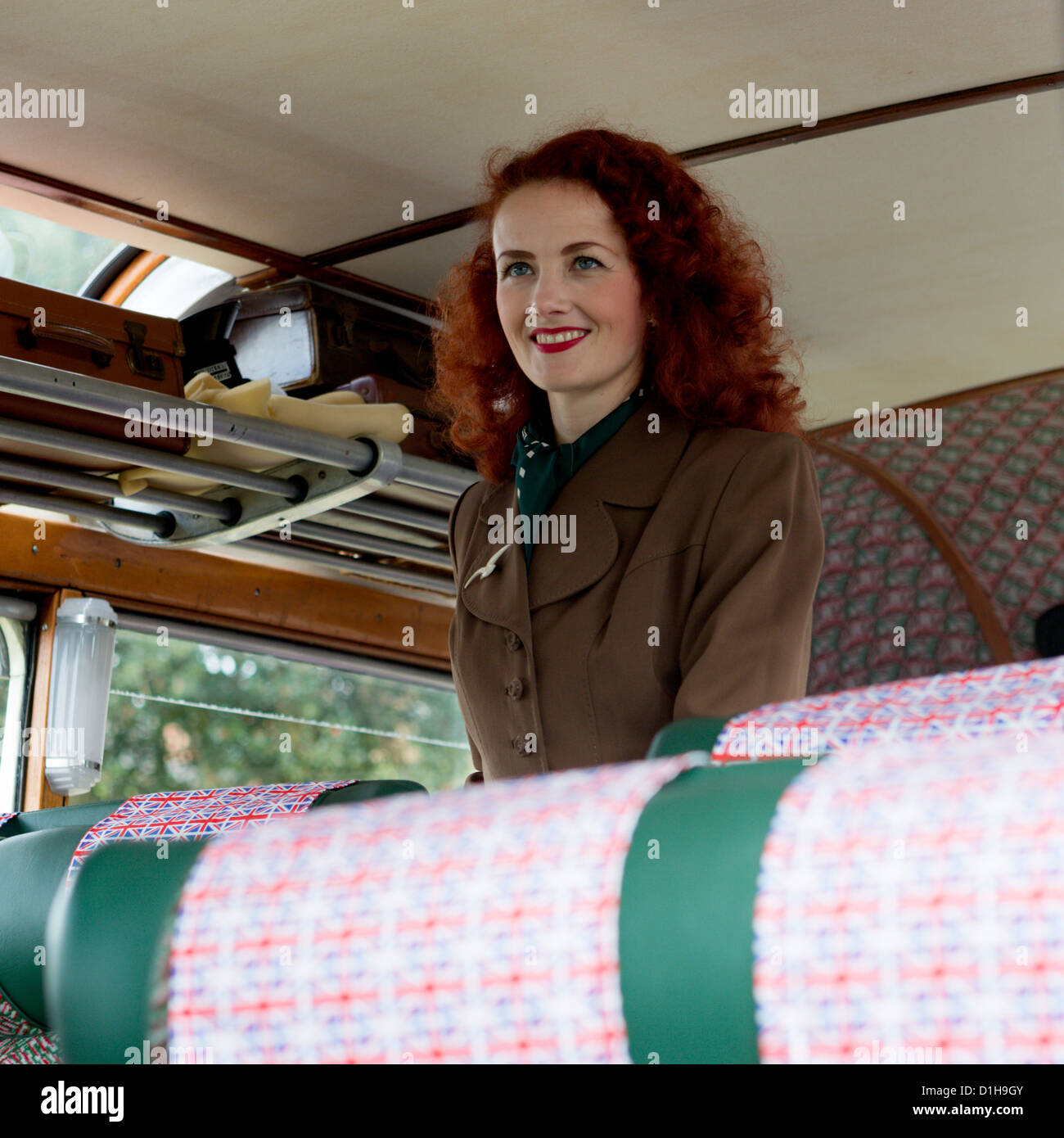Lola Lamour - singer & entertainer recreating the 1940's era here in a 1949 Bedford Coach Stock Photo