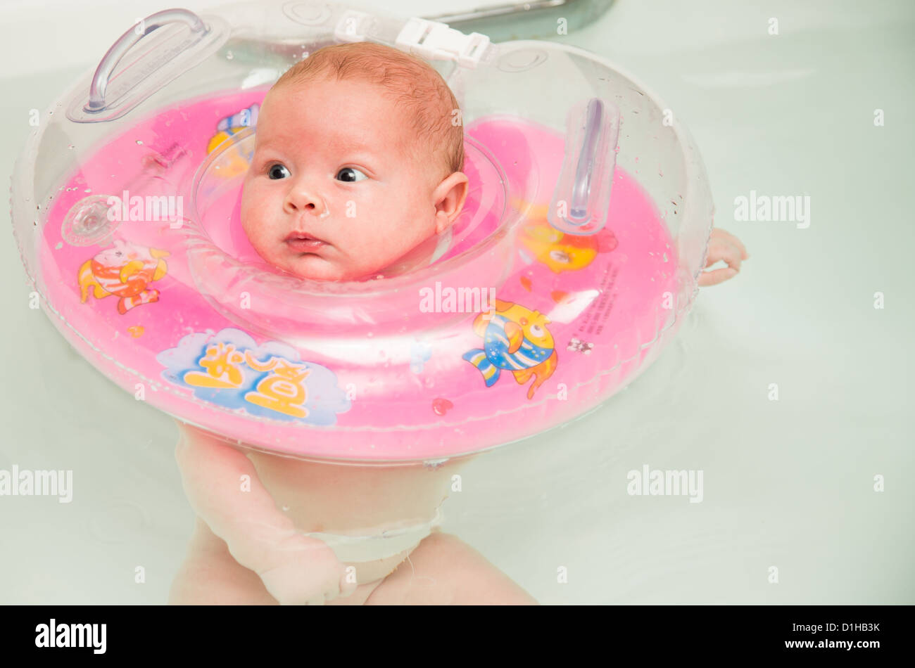 Newborn baby swimming in the bath Stock Photo Alamy
