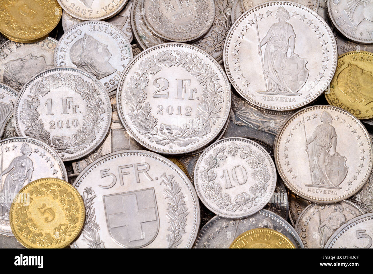 A pile of current, legal tender Swiss Francs (CHF) coins. All current Swiss coin denominations are represented in this image. Stock Photo