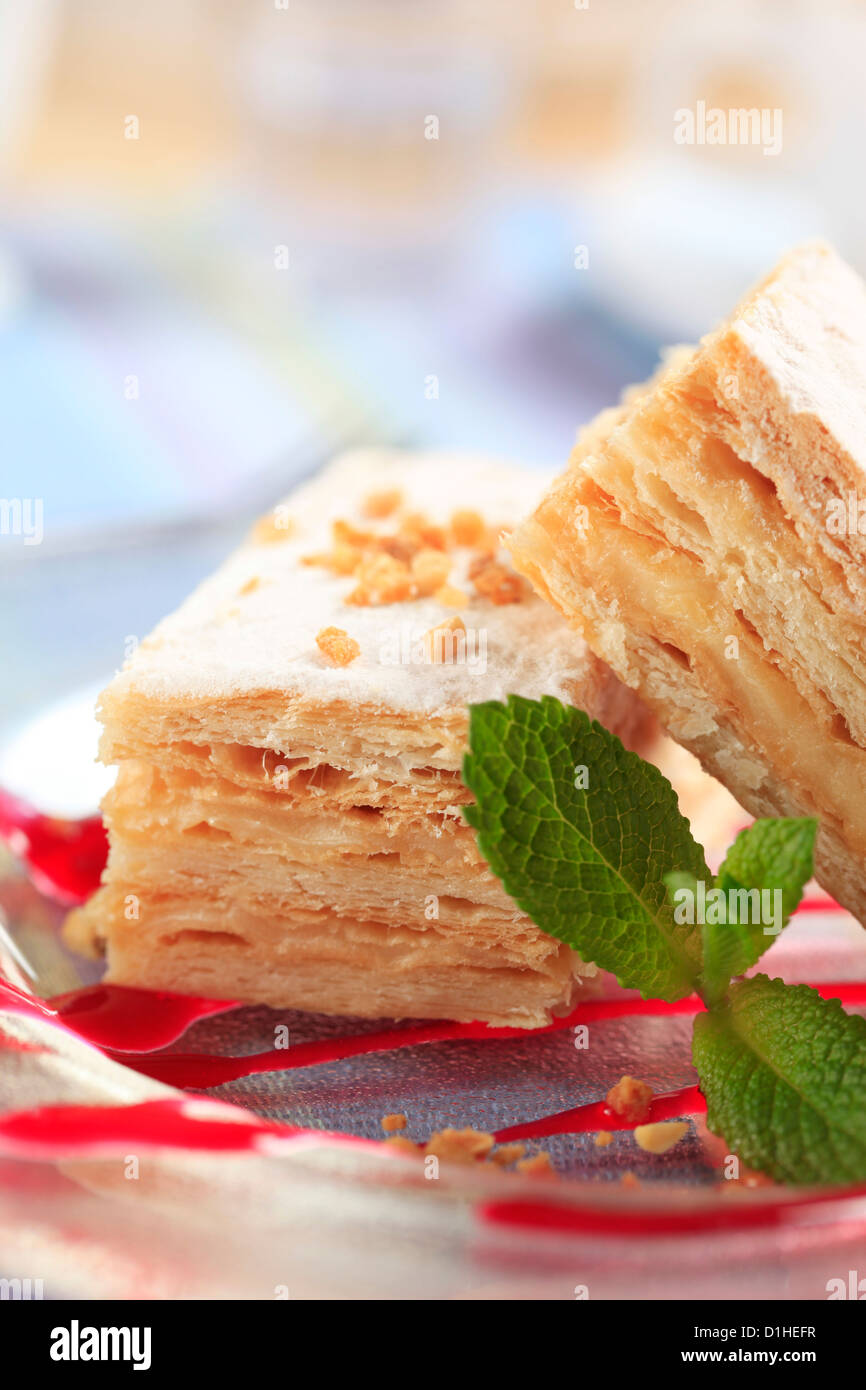 Slices of apple mille-feuille cake dusted with powdered sugar Stock Photo