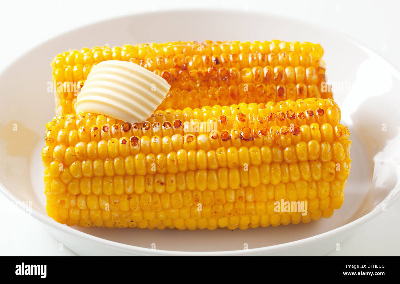 Roasted corn on the cob with butter Stock Photo Alamy