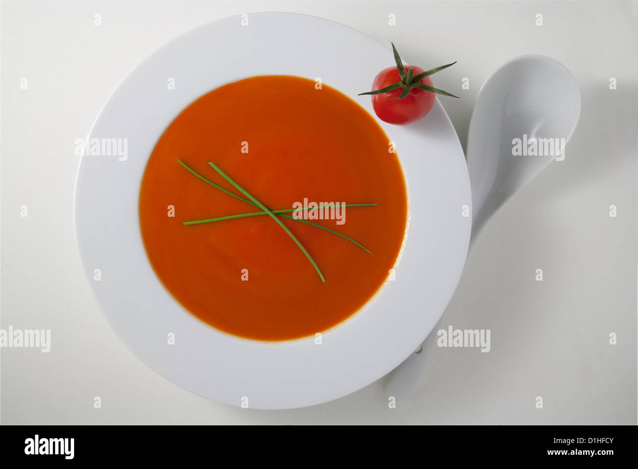 tomato soup in white bowl on white Stock Photo