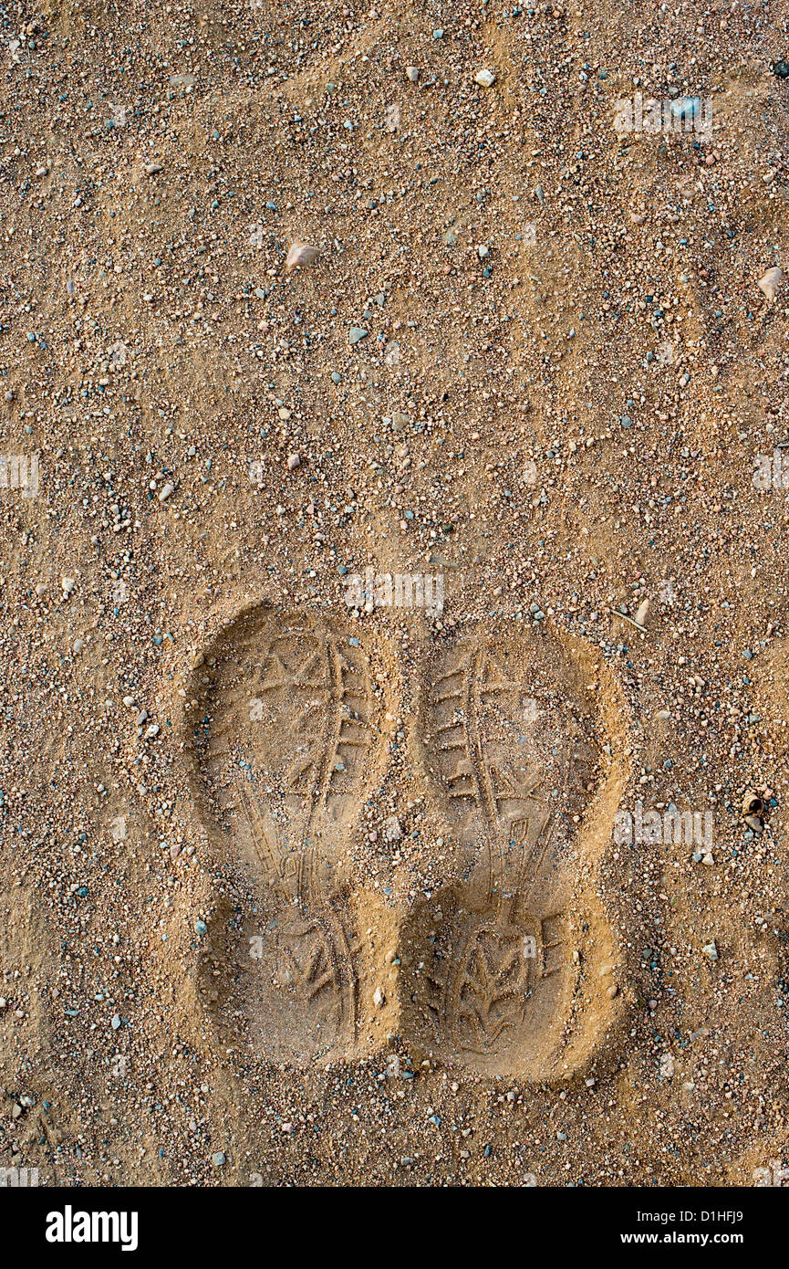 Footprints on a dusty dirty indian track Stock Photo