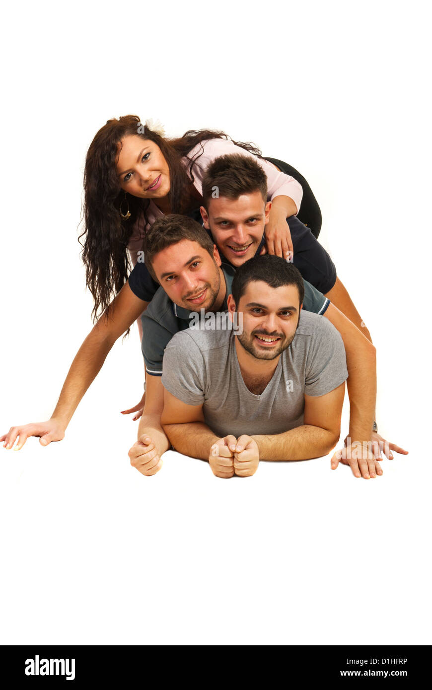 Happy friends lying on top of each other isolated on white background