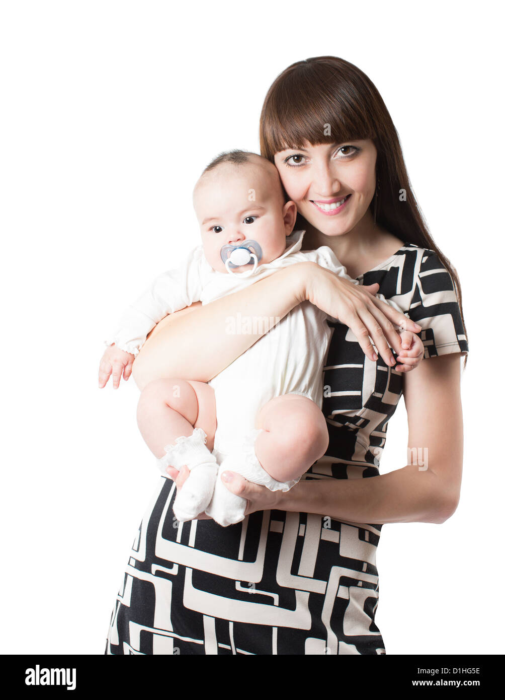 Happy mom and baby girl hugging on isolated white background Stock Photo