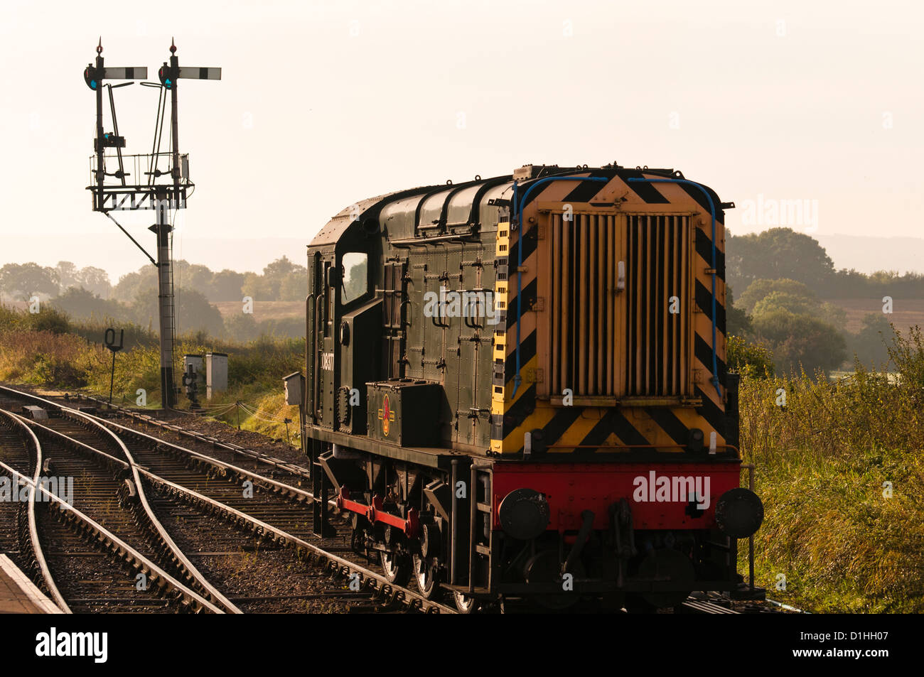 A Diesel Electric Shunter on the West Somerset Railway  with  semaphore signals in the background recreating a mid 1960s scene. Stock Photo