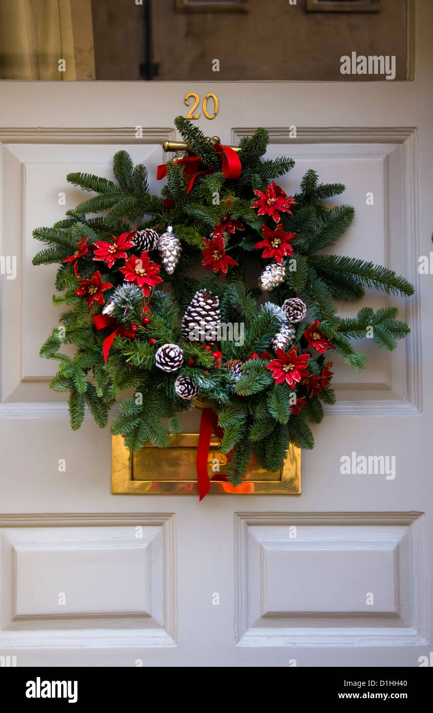 Christmas wreath on front door Stock Photo - Alamy