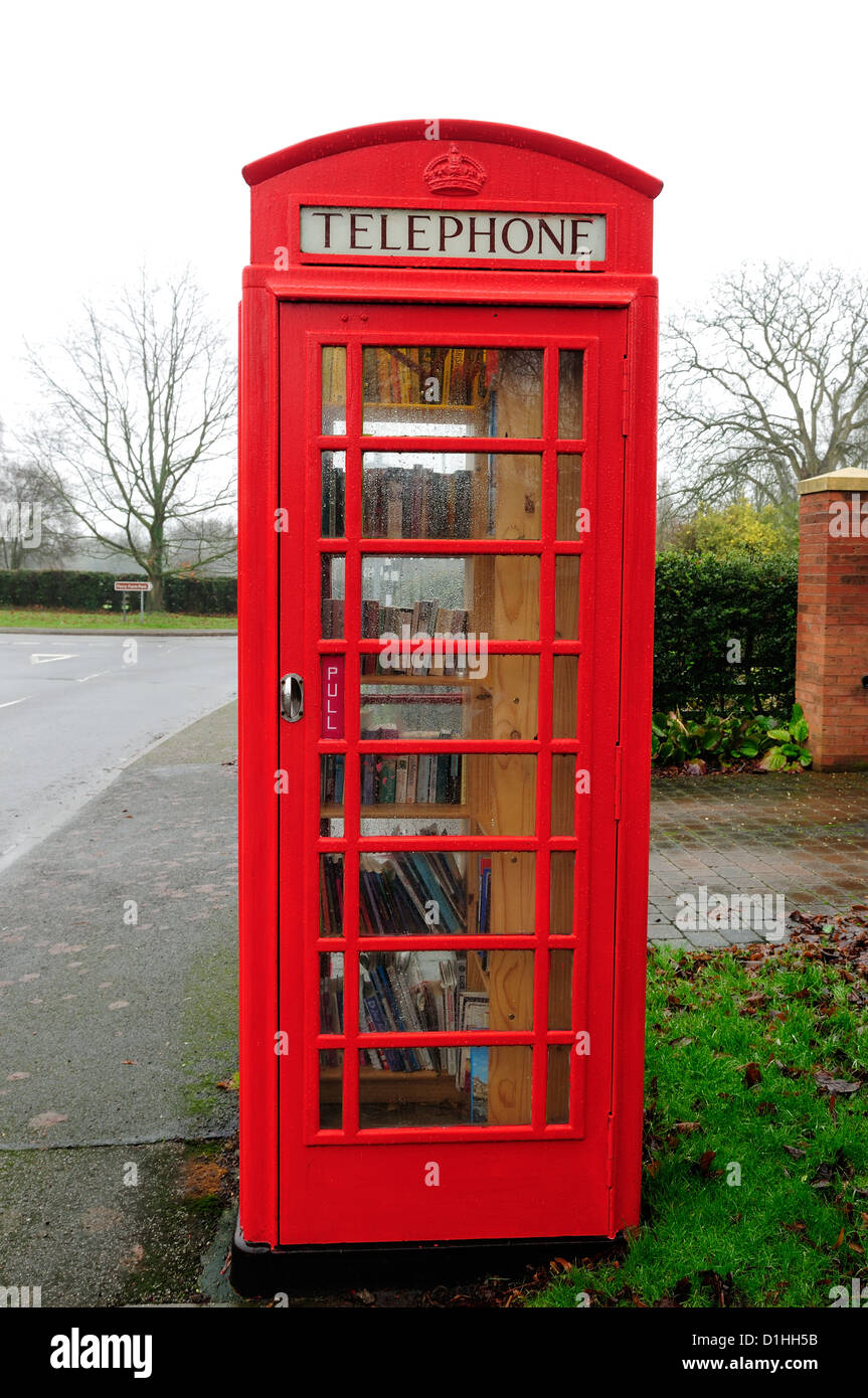 Red Telephone Box,Book Exchange .Hoveringham Nottinghamshire. Stock Photo