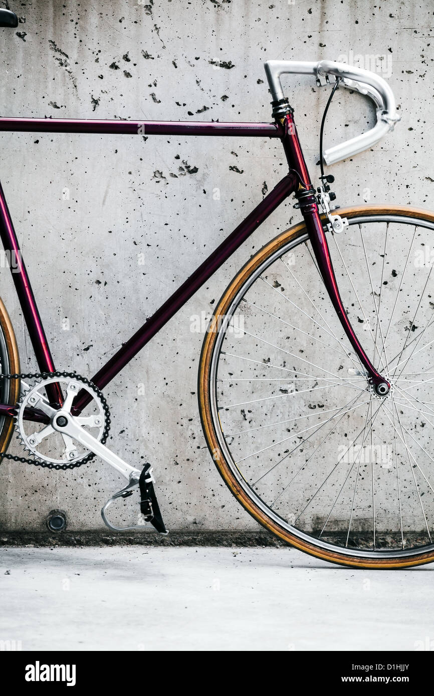 City bicycle fixed gear and concrete wall Stock Photo