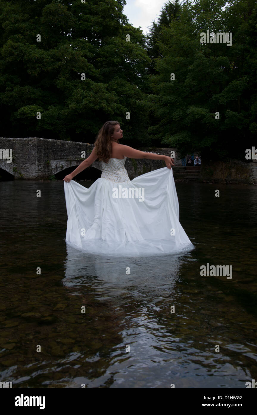 Wedding dress in the river Stock Photo - Alamy