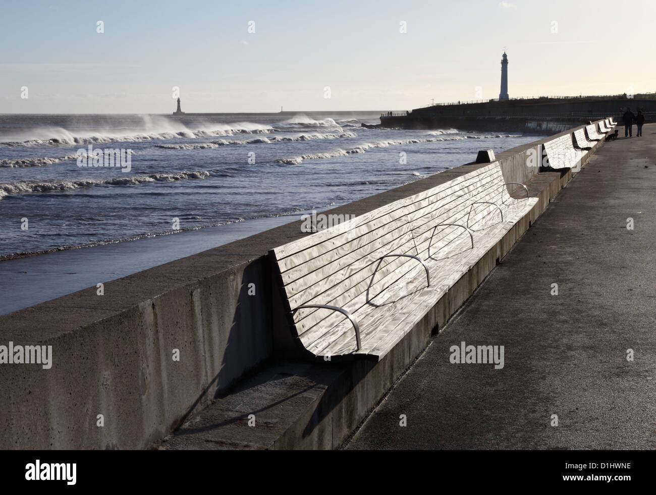 Strong westerly winds batter the north east coast blowing spray over waves, Roker, Sunderland Stock Photo