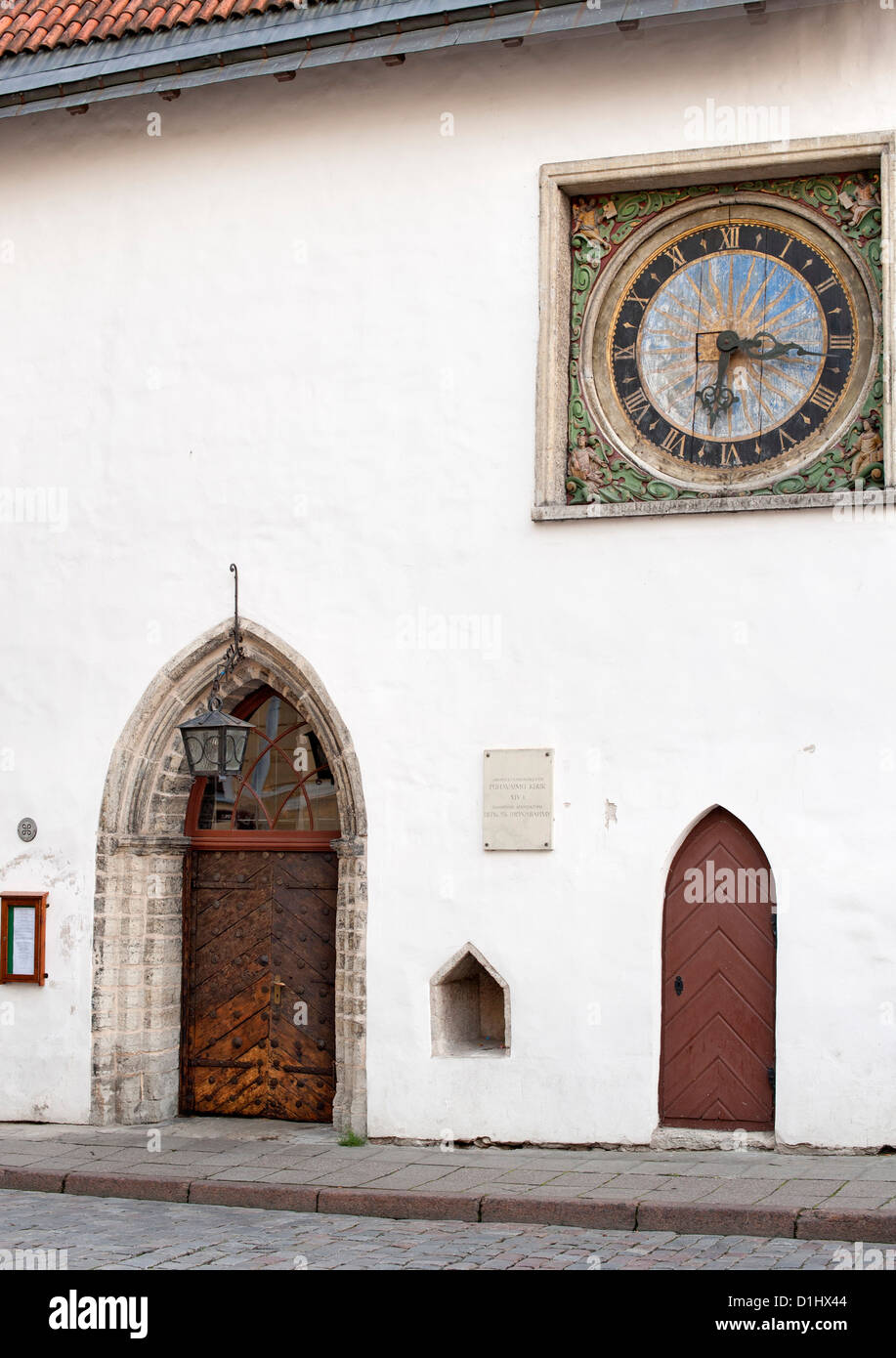 Clock on the wall of the Church of the Holy Spirit in Tallinn, the capital of Estonia. Stock Photo