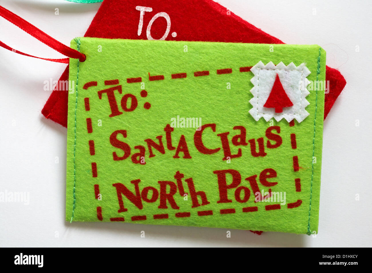 letter decorations addressed to Santa Claus North Pole set on white background Stock Photo