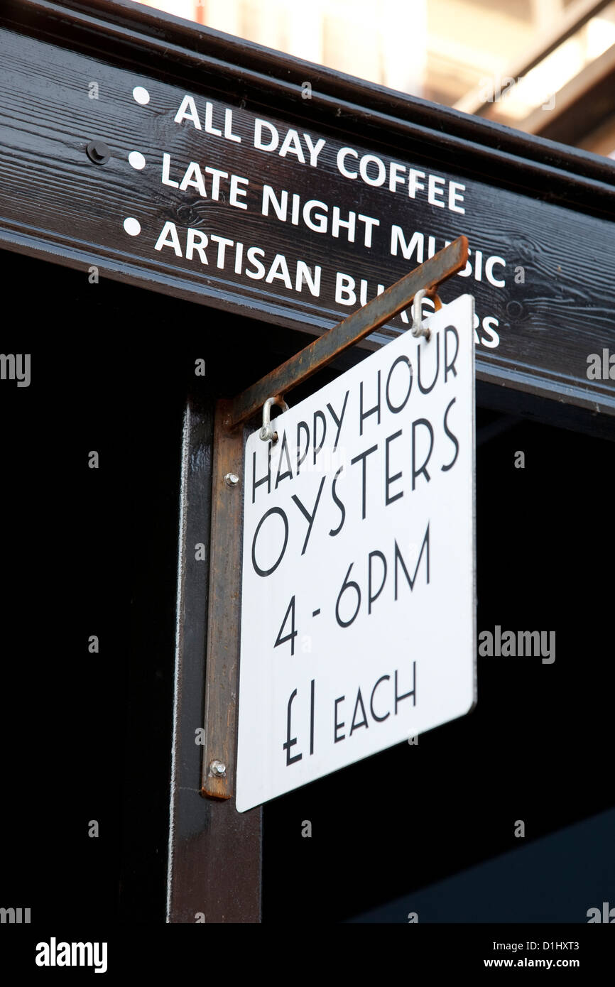 Happy Hour Sign at Oyster Bar Restaurant in Oban, Scotland Stock Photo
