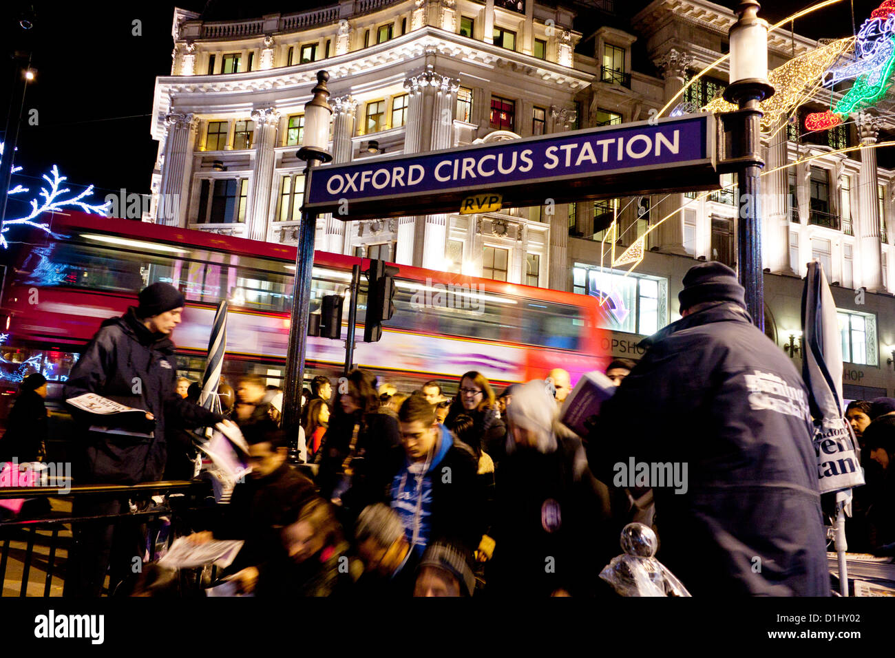 Shoppers and commuters descending stairs to Oxford Circus Underground station London England UK Stock Photo