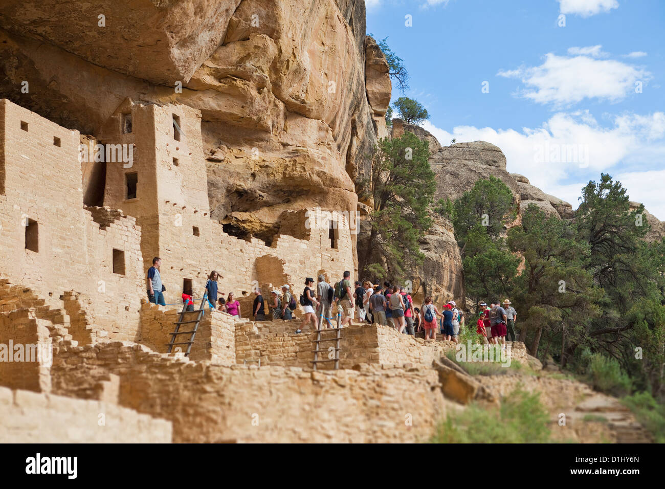 Tourists visit Cliff Palace cliff dwellings in Mesa Verde National Park, Colorado Stock Photo
