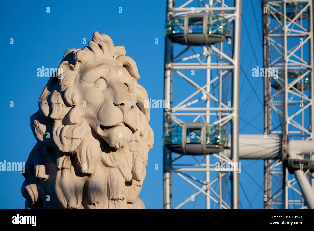 The South Bank Lion stone sculpture with London Eye Millennium Ferris Wheel in background London England UK Stock Photo