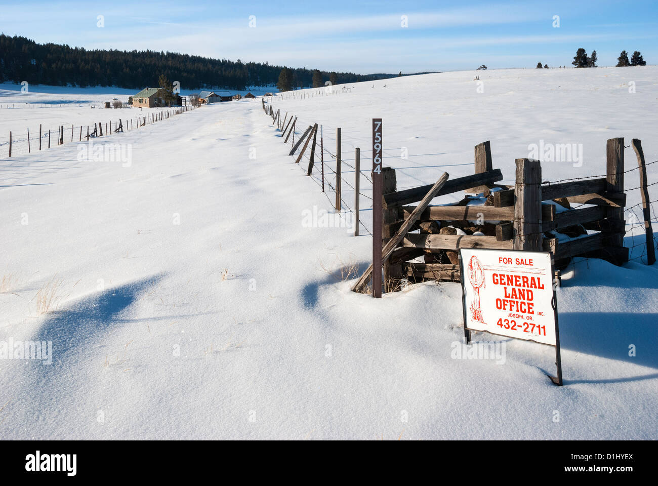 Real estate for sale sign in a snowy remote area in Northeast Oregon