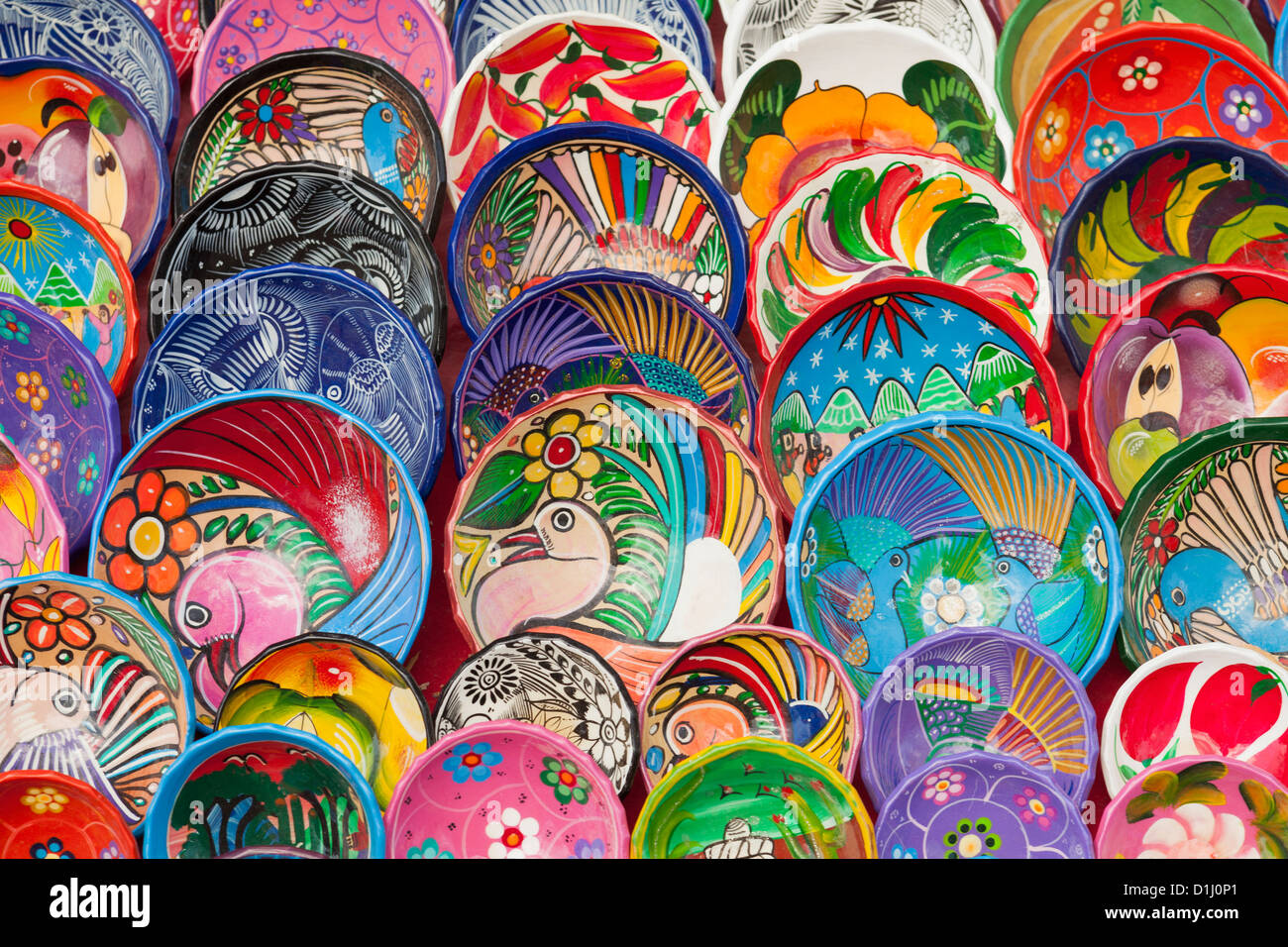 Colorfully painted plates and bowls, Chichen Itza, Yucatan Peninsula, Quintana Roo, Mexico Stock Photo