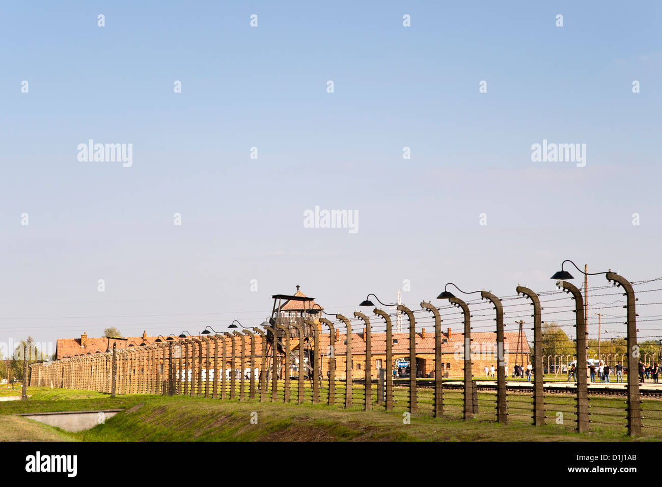 Electrified, barbed-wire fencing at the museum of the former Auschwitz II–Birkenau concentration camp in southern Poland. Stock Photo