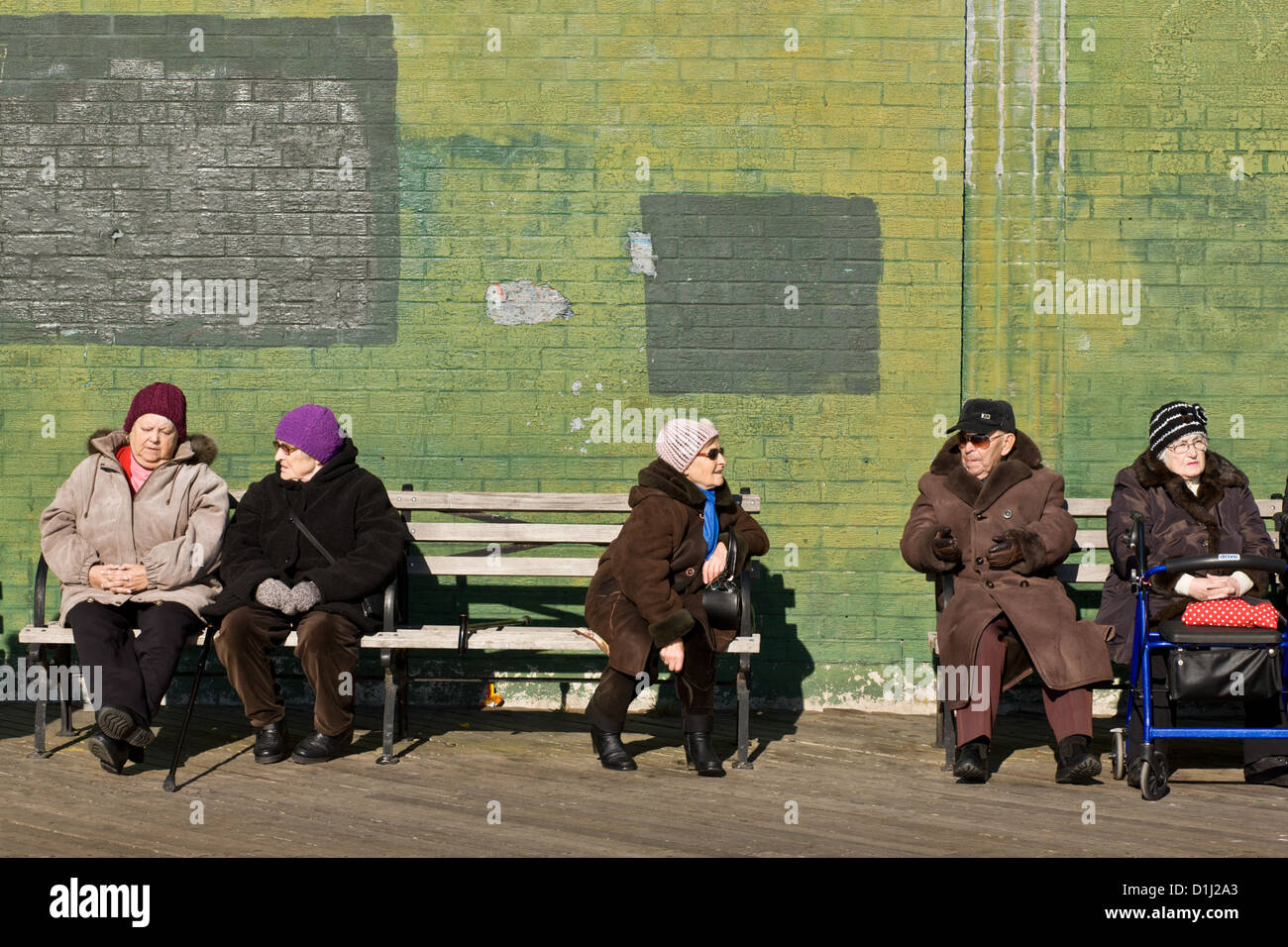 Elderly folks, mostly Russian immigrants, getting some December sun, Brighton Beach aka 'Little Odessa', Brooklyn, New York, USA. Stock Photo