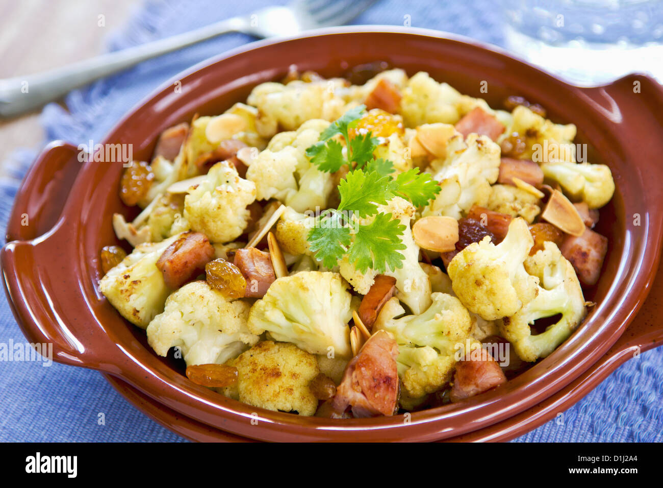 Roasted Cauliflower with Ham,almond and raisin Stock Photo Alamy