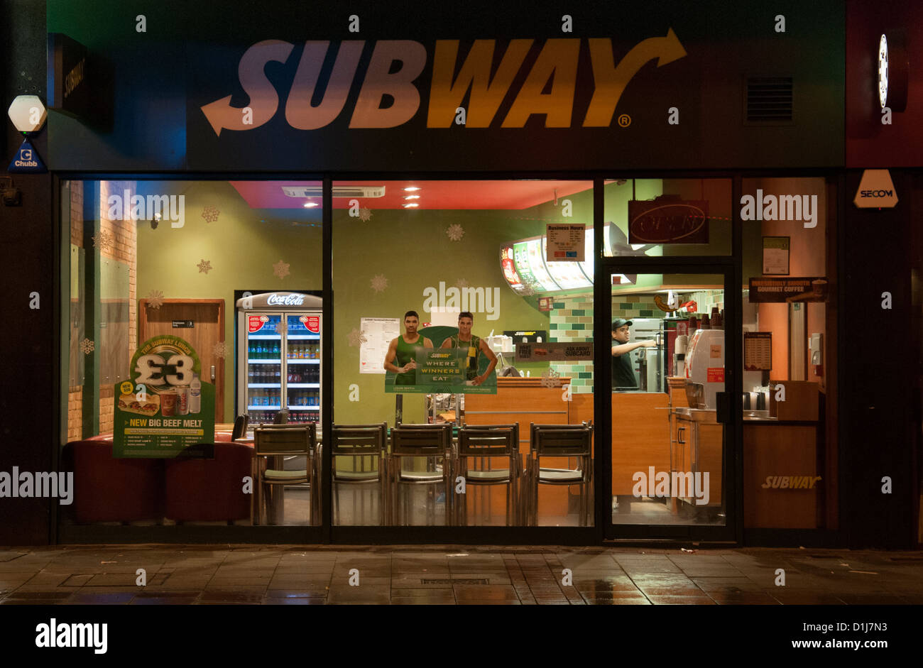 Exterior of an empty Subway fast food restaurant at night, England, UK. Stock Photo
