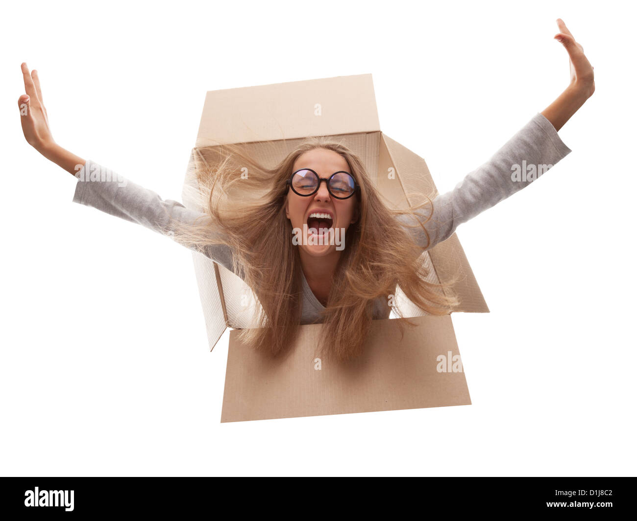 The girl in a cardboard box flies in white background Stock Photo