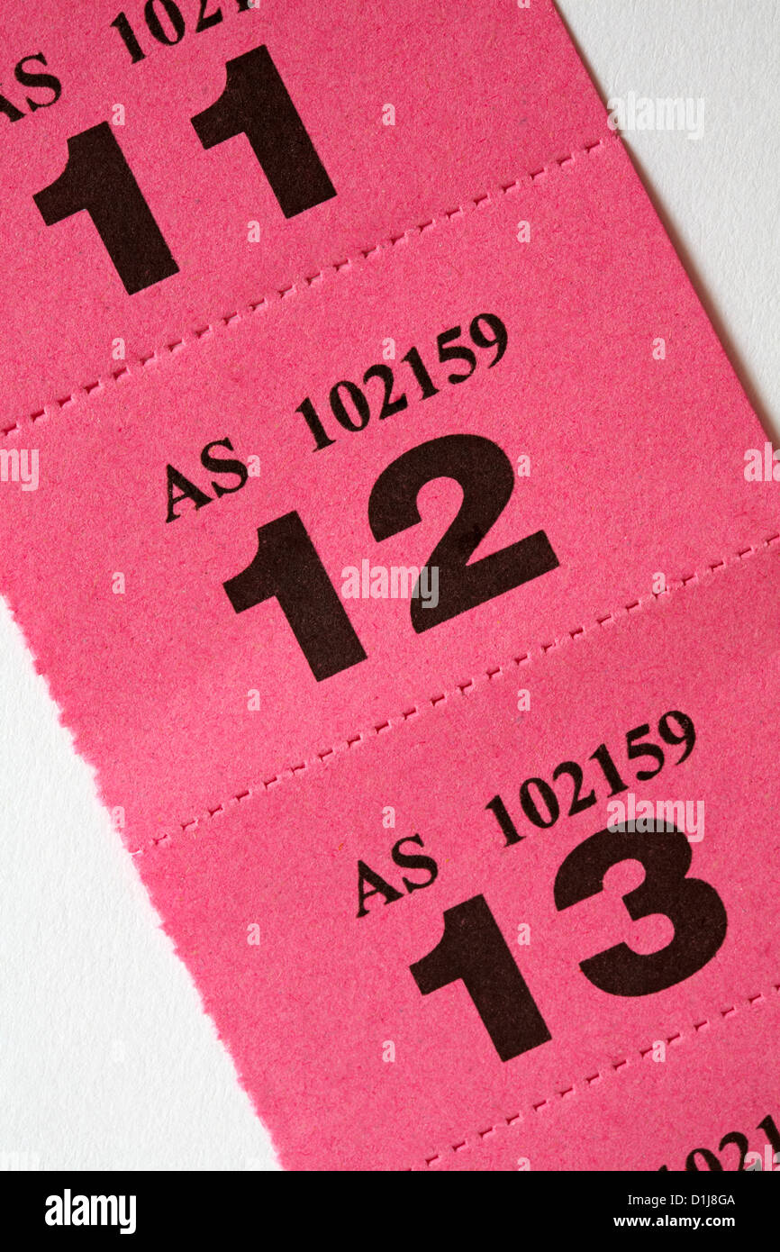 strip of pink raffle tickets on white background Stock Photo - Alamy