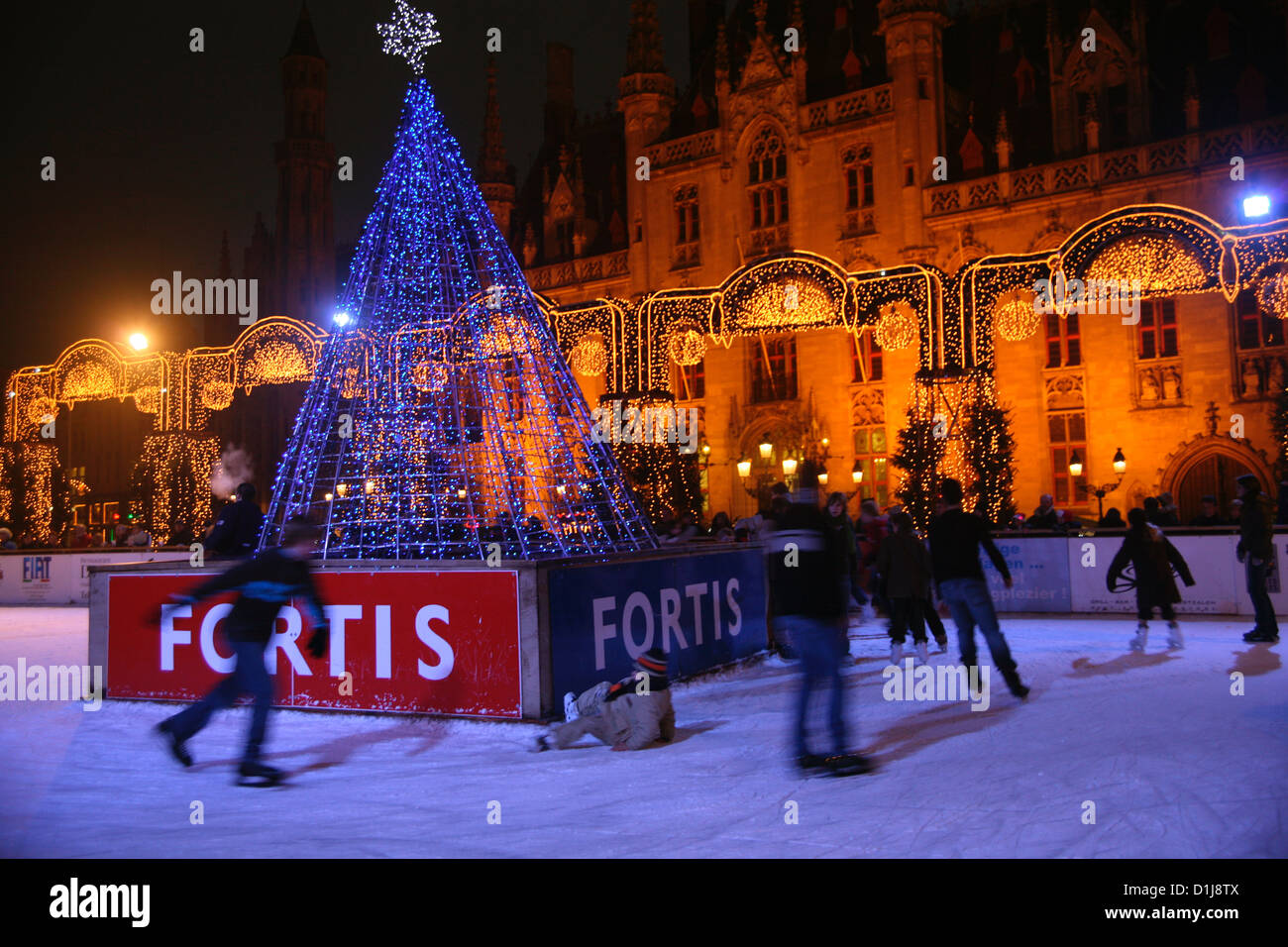 Skaters in the main square in Bruges, Belgium,  on Christmas eve Stock Photo