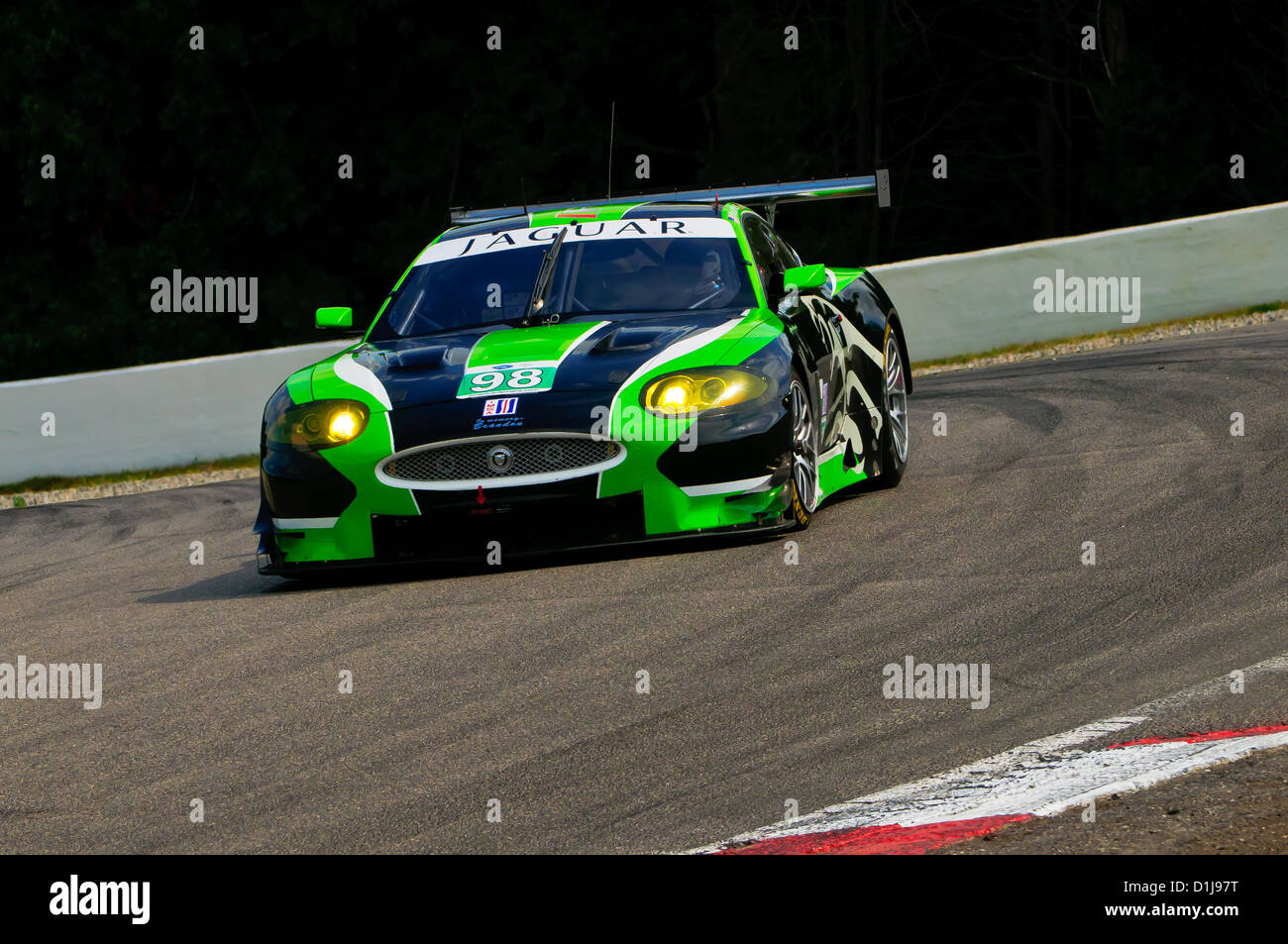 The top finishing Jaguar XKR of drivers Jones and Moran speeds through turn 3 during Saturday's practice session Stock Photo