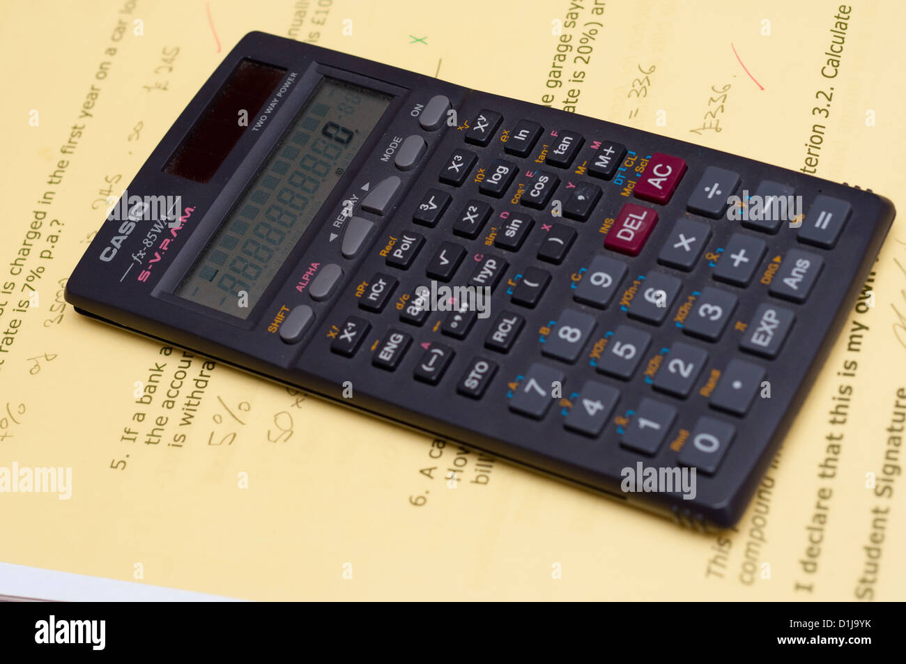 Scientific calculator on student school work Stock Photo Alamy