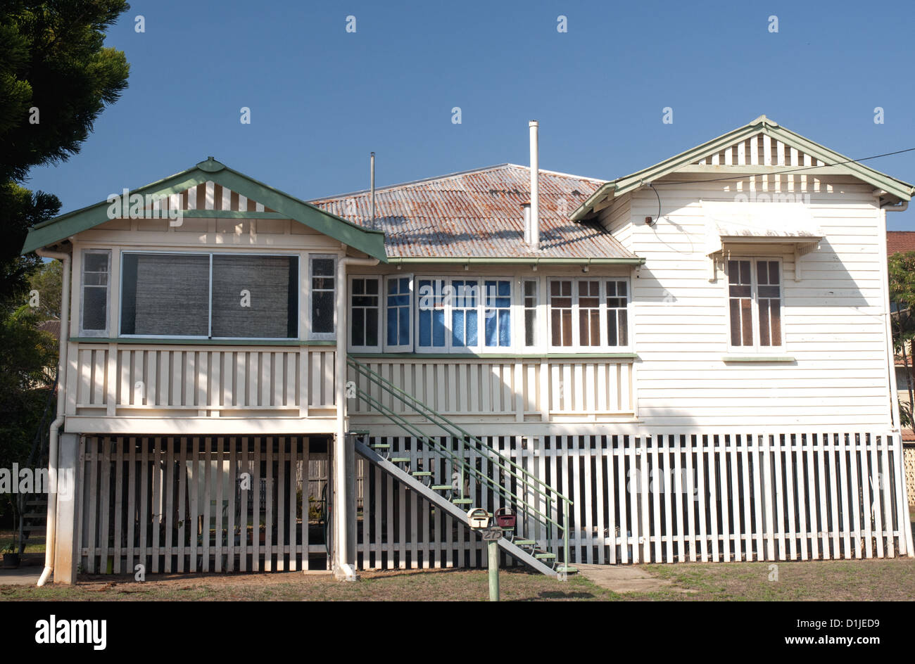 A traditional Queenslander home raised on stilts, in tropical Cairns, North Queensland Stock Photo