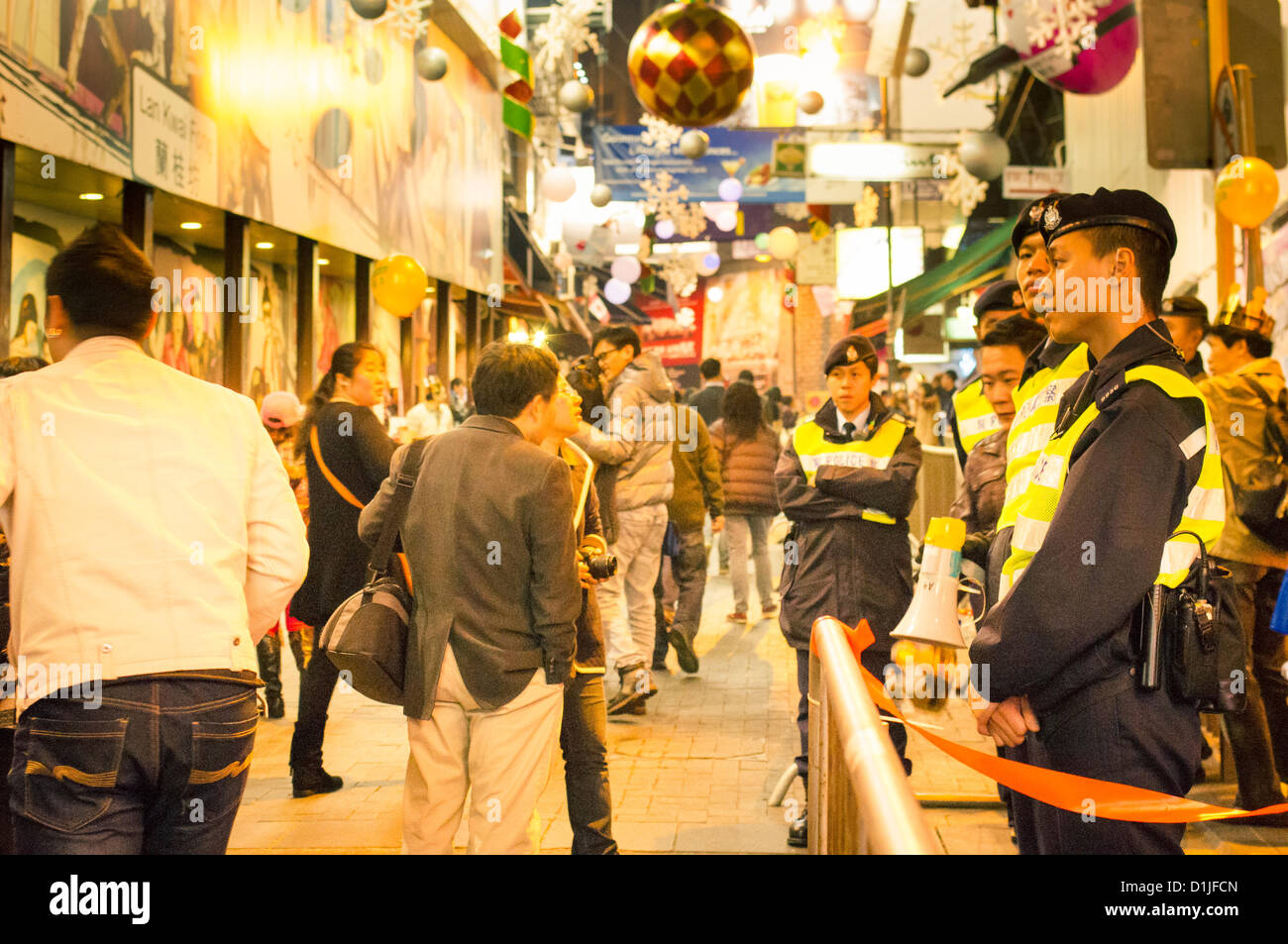 Christmas celebrations in Hong Kong, area around Lan Kwai Fong had been regulated to control the crowd. Stock Photo