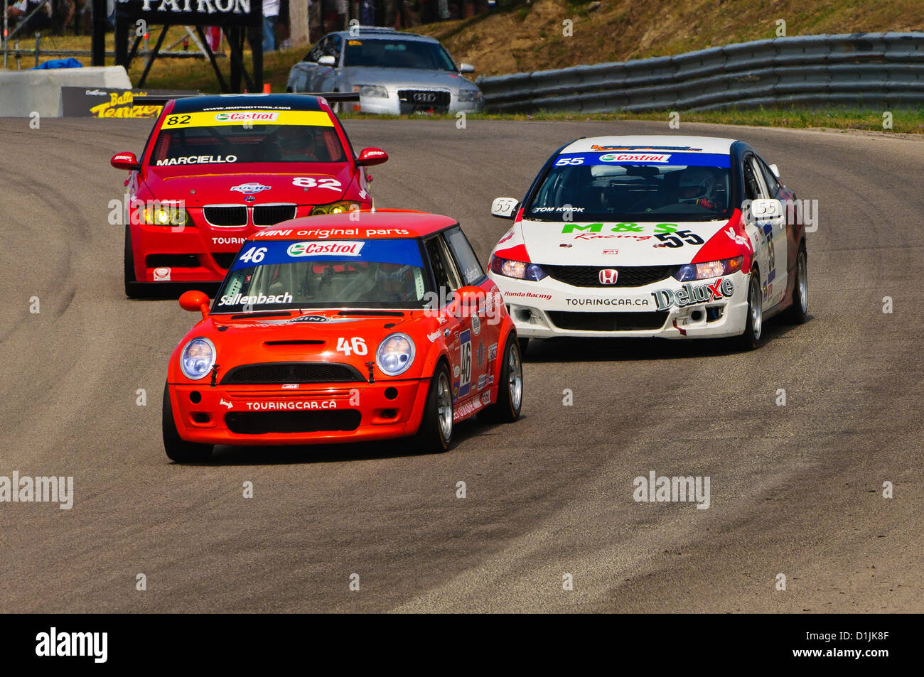 A Mini Cooper defends during the Canadian Touring Car Championship (CTCC) race at The Mobil-1 Grand Prix Weekend at Mosport Stock Photo