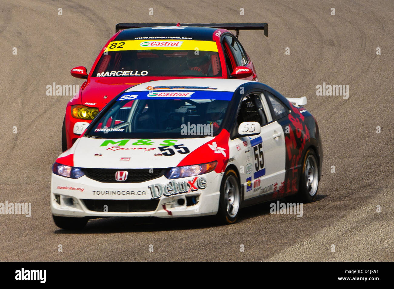 A Honda  passes a car during the Canadian Touring Car Championship (CTCC) race at The Mobil-1 Grand Prix Weekend at Mosport Stock Photo