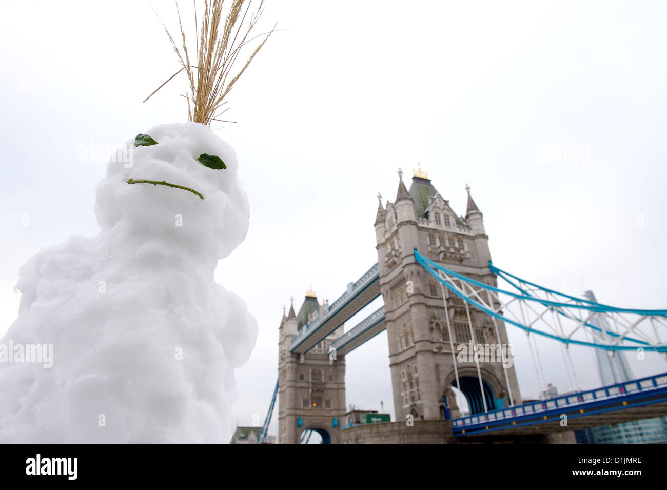 Snowman with Tower Bridge and the Shard building in the background, London Borough of Tower Hamlets, East London, England, UK Stock Photo