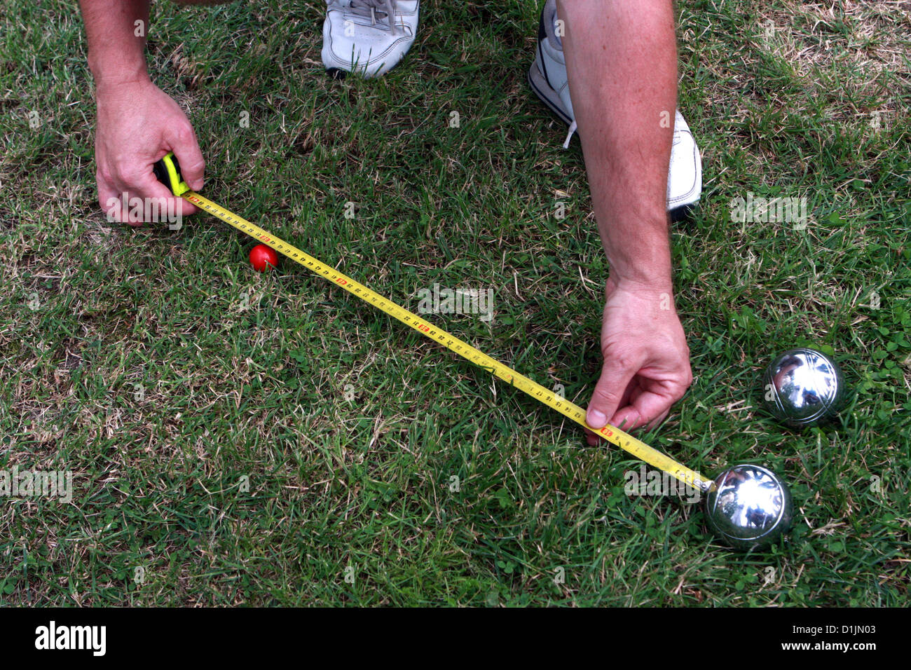measuring the distances between the balls,petanque Stock Photo