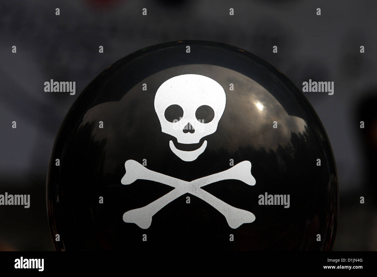 a black small inflatable balloon with a skull symbol Stock Photo