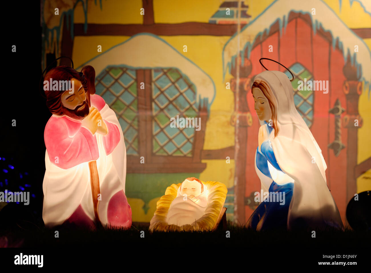 Nativity scene in front of house lit up for annual Christmas season