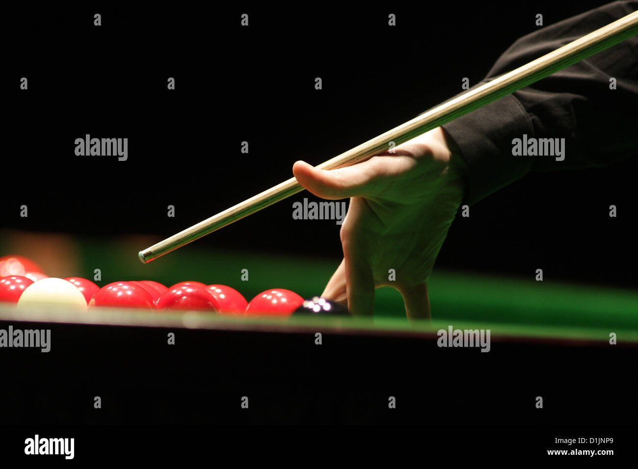 Snooker player man aiming the cue ball Stock Photo